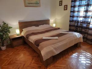Postel nebo postele na pokoji v ubytování Apartman Ana