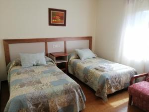 Katil atau katil-katil dalam bilik di Casa La Granda