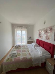 Postel nebo postele na pokoji v ubytování Apartmani Velnic 2