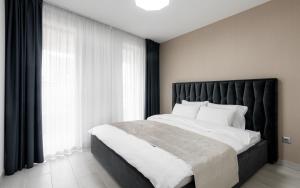Katil atau katil-katil dalam bilik di Avand Apartments Debrecen