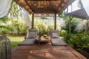 Κήπος έξω από το Villa de charme proche plage et lagon