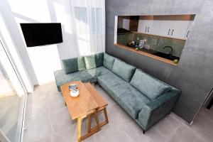 Posedenie v ubytovaní Rikanthos Stone Sea View Apartment Ι