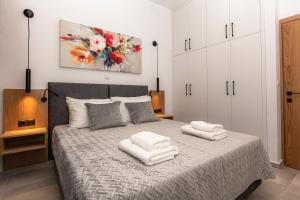 Posteľ alebo postele v izbe v ubytovaní Rikanthos Stone Sea View Apartment Ι