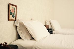 Postel nebo postele na pokoji v ubytování L'AtelieR Guest House Yonago