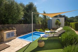 The swimming pool at or close to Casa Azul Stylish beach house for 4 adults and 1 child in Cala Llombards