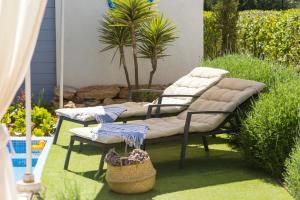 A garden outside Casa Azul Stylish beach house for 4 adults and 1 child in Cala Llombards