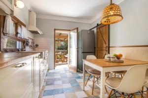 A kitchen or kitchenette at Casa Azul Stylish beach house for 4 adults and 1 child in Cala Llombards
