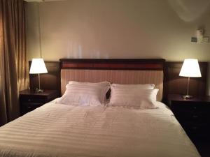 En eller flere senge i et værelse på D savoy Afamosa by SH