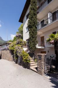 a building with stairs and plants on it at Haus Dorfblick in Caldaro