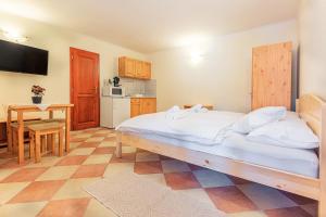 Posteľ alebo postele v izbe v ubytovaní Varázskő Apartman Gyula