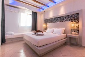 Voodi või voodid majutusasutuse Mikri Vigla Hotel Beach Resort toas