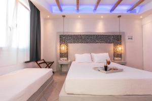 Voodi või voodid majutusasutuse Mikri Vigla Hotel Beach Resort toas