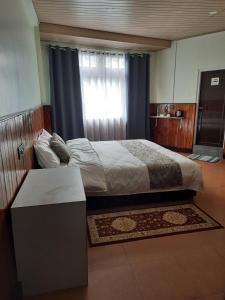 Postel nebo postele na pokoji v ubytování Kanari B&B