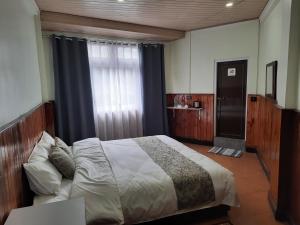 Postel nebo postele na pokoji v ubytování Kanari B&B