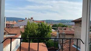a view of a city from a balcony at Apartment Carina in Koper