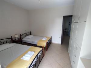 Posteľ alebo postele v izbe v ubytovaní Philoxenia Apartments II