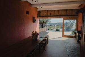 a dining room with a long table and chairs at Casinhas de Santo António in Alter do Chão