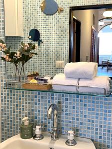 a bathroom with a sink and a mirror at La Lampara Camogli in Camogli