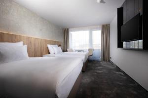 Ліжко або ліжка в номері OREA Congress Hotel Brno