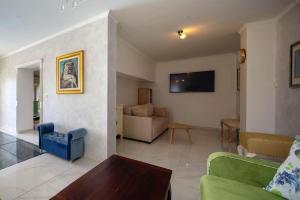 a living room with a couch and a table at Villa Amare, Makarska in Makarska