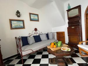 a living room with a couch and a table at La Lampara Camogli in Camogli