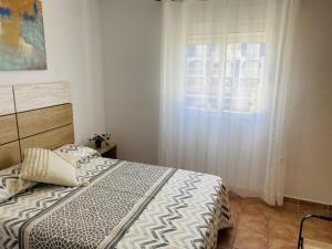 Postel nebo postele na pokoji v ubytování Anacasa Bullent Playa Rabdells AP361