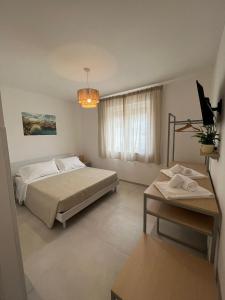 A bed or beds in a room at B&B Casa Laforgia Soffio Mediterraneo