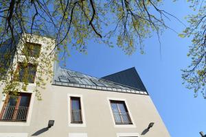 a building with a solarium on top of it at Luxury apartment with a balcony and view in Riga Old Town in Riga