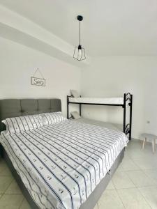 Postel nebo postele na pokoji v ubytování Apartmani Tolić