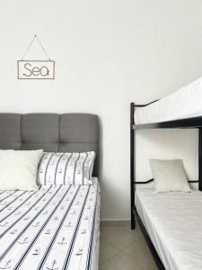 Postel nebo postele na pokoji v ubytování Apartmani Tolić