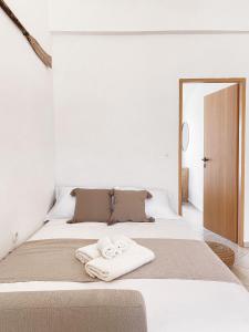 Postel nebo postele na pokoji v ubytování Apartmani Tolić