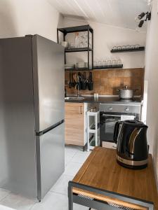 Kuchyň nebo kuchyňský kout v ubytování Apartmani Tolić