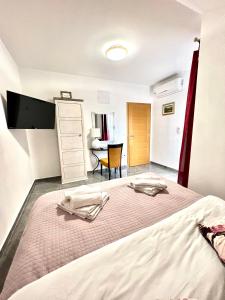 Postel nebo postele na pokoji v ubytování Residence Antiqua Rooms