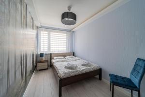 Posteľ alebo postele v izbe v ubytovaní Widok z Centrum