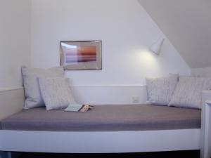Postel nebo postele na pokoji v ubytování Eremitage Sylt