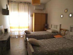 Postel nebo postele na pokoji v ubytování B&B Libellula