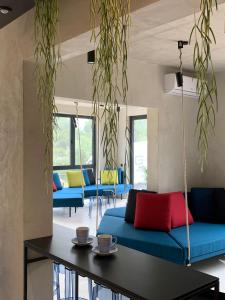 a living room with blue couches and a table at Moro Inn in Korčula