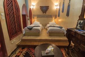Ένα ή περισσότερα κρεβάτια σε δωμάτιο στο Riad Zen House +32 φωτογραφίες
