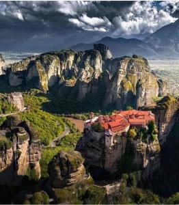 a view of a monastery on a mountain cliff at Holiday Meteora A in Kalabaka