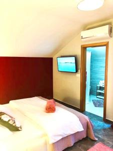 Postel nebo postele na pokoji v ubytování Residence Antiqua Rooms