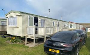 a car parked in front of a tiny house at 187 sealands in Ingoldmells