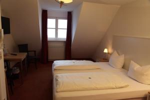 Postel nebo postele na pokoji v ubytování Hotel Bacchus Wine & Bites + 25 fotografií