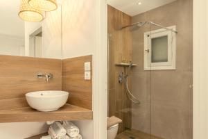 a bathroom with a sink and a shower at Konstantinos in Adamantas +84 photos