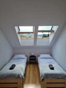 Krevet ili kreveti u jedinici u objektu Apartamenty Pod Dachem