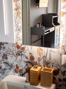a mirror above a sink in a bathroom at B&B Sole Mare Luna in Lu Lioni +22 photos