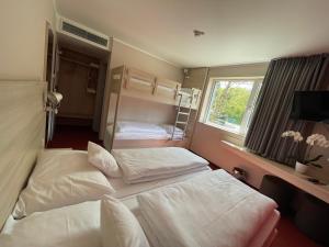 Postel nebo postele na pokoji v ubytování Serways Hotel Spessart
