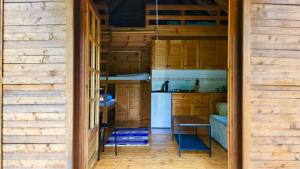 a kitchen with wooden cabinets and a table at Una Kamp in Bosanska Krupa +54 photos