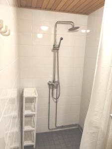 a bathroom with a shower with a shower curtain at Reipas in Kotka +76 photos