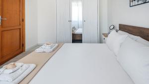 Postel nebo postele na pokoji v ubytování Coral Coast Alghero