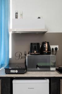 Una cocina o cocineta en C-view Apartments